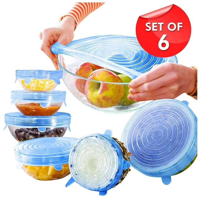Reusable blue stretch food covers fitted over bowls and cut fruit